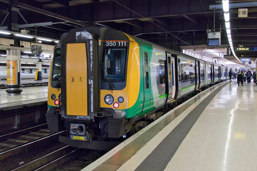 350111, LN 11.54 Birmingham New Street-London Euston (2Y08, 1E), London Euston station 
 Having arrived at Euston, our train formed by 350111, stands at the blocks. On this occasion, we took a slightly later train from Northampton, the 11.54 from Birmingham New Street that got us into Euston just after lunchtime. 
 Keywords: 350111 11.54 Birmingham New Street-London Euston 2Y08 London Euston station