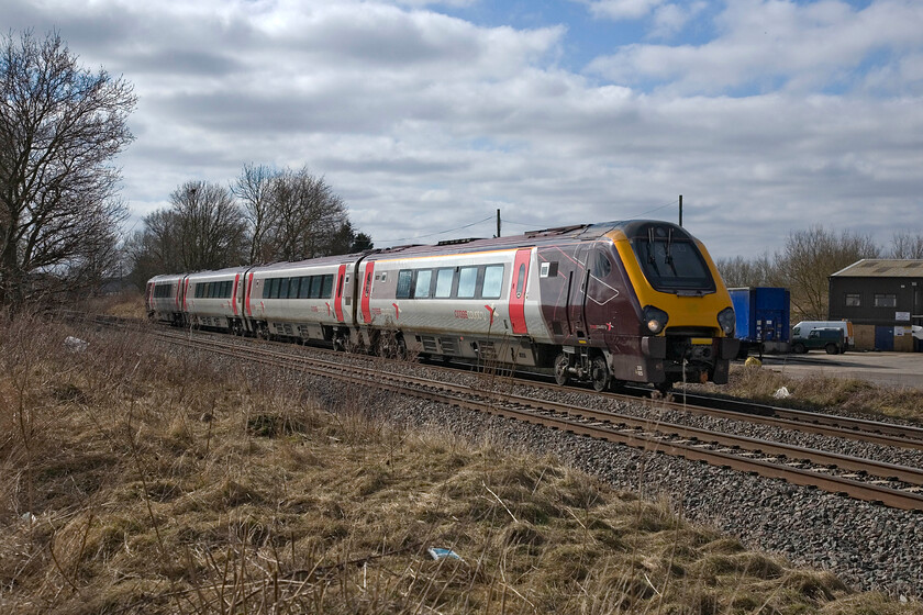 220025, XC 09.40 Reading-Newcastle, King's Sutton SP486377 
 CrossCountry's 09.40 Reading to Newcastle service passes just north of King's Sutton and will be preparing for its next stop at Banbury worked by 220025. In order to take this photograph, a short ladder is required to gain a little height above the railway boundary fence and the vegetation following a short and potentially muddy walk (but not today) along a farm track from the road. 
 Keywords: 220025 CrossCountry Voyager 09.40 Reading-Newcastle King's Sutton SP486377