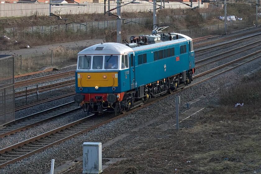 86259, 12.13 Acton Lane Reception Sidings-Rugby Carriage Sidings (0Z88, RT), site of Roade station 
 Looking particularly shiny after some winter attention 86259 'Les Ross/ Peter Pan' runs light engine through Roade past the site of the village's former station. The vintage AL6 locomotive dating from January 1966 is running as 0Z88, the 12.13 Acton Lane Reception Sidings to Rugby Carriage Sidings. It will stay at Rugby until its next charter duty at the end of February unless it is able to find any other work in the meantime. 
 Keywords: 86259 12.13 Acton Lane Reception Sidings-Rugby Carriage Sidings 0Z88 site of Roade station Les Ross Peter Pan