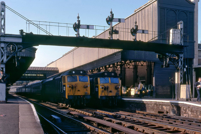 50025, ECS & 50041, 16.25 London Paddington-Plymouth (1B14), Exeter St. David's station 
 Photograph two of 50041 'Bulwark' but this time standing in the shade at Exeter St. David's next to its sister 50025 'Invincible'. Both the Class 50s are in their pre-refurbished states with the BR emblems on the cab sides as when first released into traffic back in the late 1960s. 50025 has just worked in from Waterloo and is now stabled on the centre road ready for its return journey the following morning. 50041 is waiting to leave with the 16.25 Paddington to Plymouth service. 
 Keywords: 50025 50041 16.25 London Paddington-Plymouth 1B14 Exeter St. David's station jpg