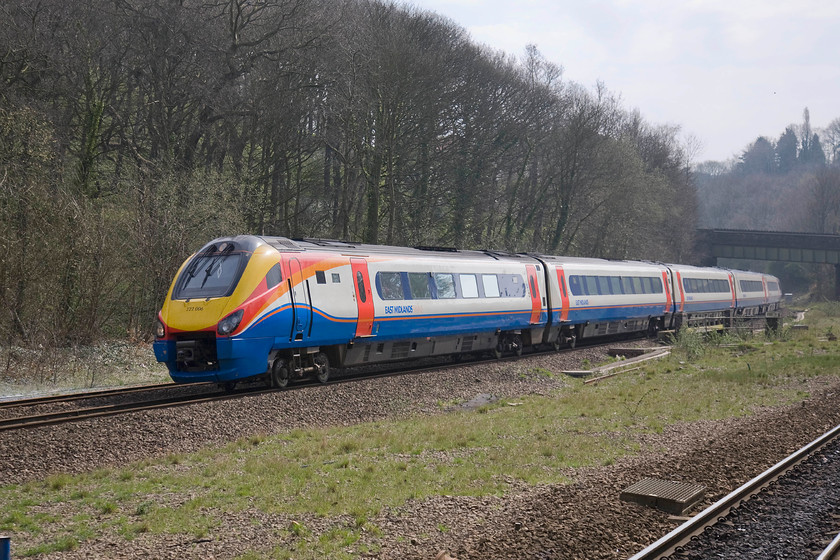 222006, EM 11.58 London St. Pancras-Sheffield (1F30), Dore station 
 East Midlands' 222006 has just emerged from Bradway Tunnel and is seen passing Dore station's single platform on which I am standing. The train has a short distance to go before it will arrive into Sheffield with the 11.58 from London St. Pancras. The space in the foreground once contained a second track for the Hope Valley line and an island platform serving both that and the down Midland line on which the meridian is travelling. 
 Keywords: 222006 11.58 London St. Pancras-Sheffield 1F30 Dore station