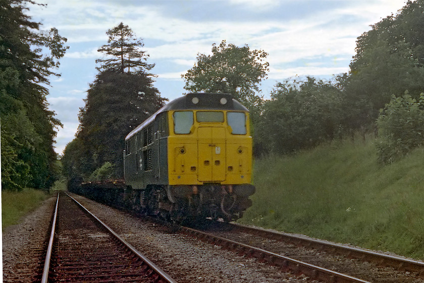 31223, down freight, Bradford-on-Avon foot-crossing ST820605 
 31223 ambles past one of Bradford-on-Avon's two foot crossings with a down freight. 31223 lead a relatively short life, it came west after being an Eastern Region engine. Then, after moving to the northwest it was withdrawn in late 1991. The light was pretty poor by now so I suspect that I was about to head for home on my trusty bike. I had a bit of an uphill push home from the floor of the Avon Valley from this location but it kept me fit! I revisited this spot in the late summer of 2014 when HSTs were being diverted along the Avon Valley, see..... https://www.ontheupfast.com/p/21936chg/30018090440/x43187-11-00-cheltenham-london-paddington