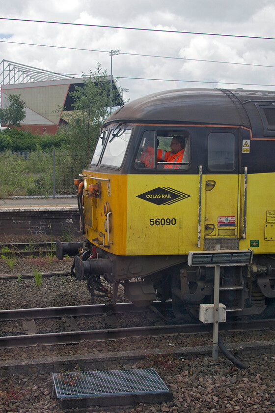 56090, 13.39 Crewe Basford Hall-Longport (6K39, RT), Crewe station 
 With Crewe Alexandria's Gresty Road stadium in the background 56090 waits to leave the adjacent station leading the 6K39 13.39 Basford Hall to Longport service that I have photographed before, see..... https://www.ontheupfast.com/p/21936chg/30024797852/x56090-13-33-crewe-basford-hall-longport . Incidentally, Crewe football supporters will have been licking their wounds at this stage in the year having just been relegated to division two. 
 Keywords: 56090 13.39 Crewe Basford Hall-Longport 6K39 Crewe station Crewe alexandria