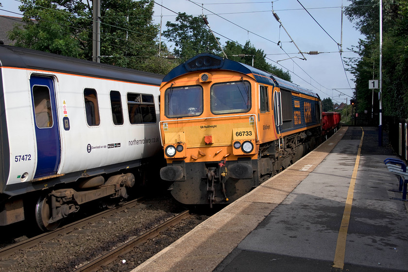 66733, 08.35 Acclington-Carlisle North yard (6G41), Cramlington station 
 This has to be the ultimate in grab-shots! As we parked the car in Cramlington station car park Andy and I were aware of the passenger service at platform two. As we walked rapidly on to the platform 66703 'Cambridge PSB' appeared at some speed from the north with the 6G41 08.35 Acklington to Carlisle North yard engineering train. With no time to even check the camera settings a picture was taken. Luckily, the composure is acceptable and the shutter speed was high enough to get it sharp; sometimes things just do happen to come together! 
 Keywords: 66733 08.35 Acklington-Carlisle North yard 6G41 Cramlington station