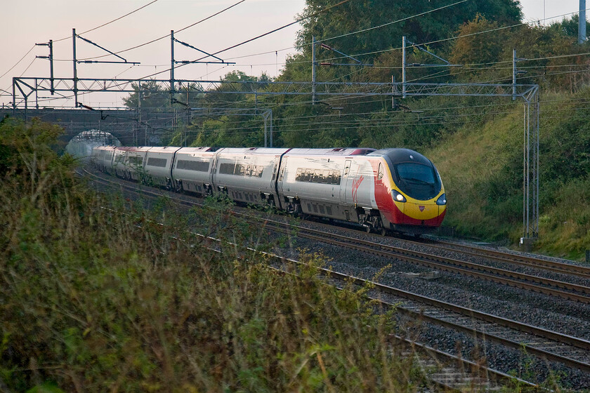 Class 390, VT 06.20 London Euston-Birmingham New Street (1G02), Roade Hill 
 An unidentified Class 390 Pendolino approaches Roade working the 1G02 06.20 Euston to Birmingham service. I was pushing the abilities of the camera in this light with this photograph needing a fair bit of Photoshop 'treatment'! 
 Keywords: Class 390 06.20 London Euston-Birmingham New Street 1G02 Roade Hill Virgin Trains West Coast Pendolino