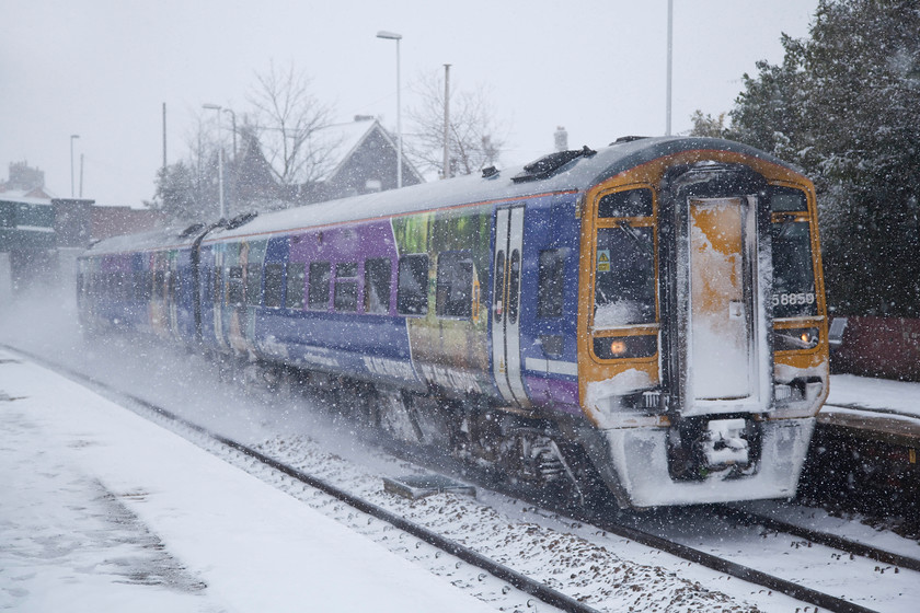 158850, NT 10.40 Leeds-Sheffield (1L81, 2L), Elescar station 
 In virtual blizzard conditions now 158850 races through Elescar station working Northern Trains' 10.40 Leeds to Sheffield. Northern Rail was pretty resilient on what was a tricky day to operate trains as this service only arrived two minutes late into Sheffield. 
 Keywords: 158850 1L81 Elescar station