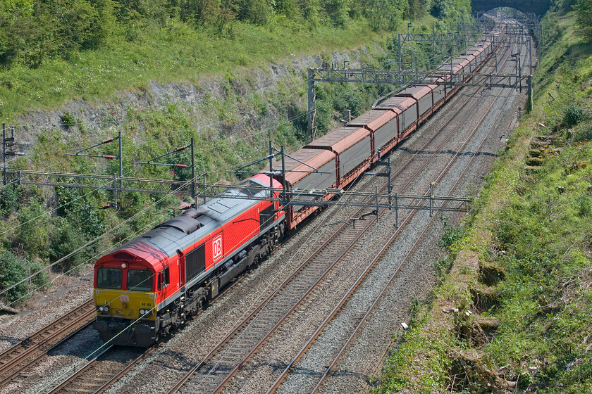 66165, 09.46 Southampton Western Docks-Halewood (6M48, 43E), Roade cutting 
 Another example of a diverted freight that I was not expecting to see with the Nuneham bridge (Oxfordshire) having reopened to traffic the previous day. DB's 66165 leads the 6M48 09.49 Southampton Western Docks to Halewood empty cartics. When freight such as this returns to ts regular route, which I suspect will now be next week, I will miss the extra variety. 
 Keywords: 66165 09.46 Southampton Western Docks-Halewood 6M48 Roade cutting DB