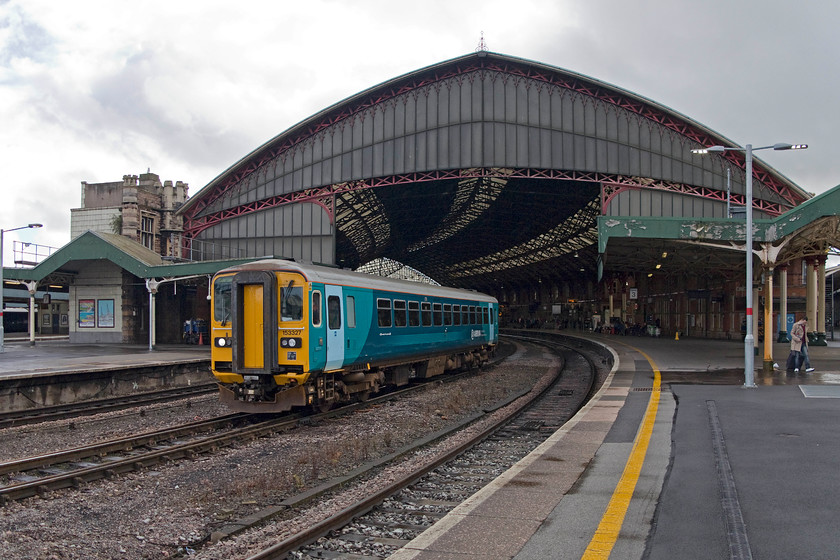 153327, AW 12.20 Cardiff Canton-Bristol Barton Hill ECS, Bristol Temple Meads station 
 153327 has just arrived in the centre road at Temple Meads station and is about to reverse and make the short journey to Barton Hill depot. It was working the 12.20 ex Cardiff Canton ECS that took a circuitous route via Chepstow and Gloucester due to the closure of the Severn Tunnel for electrification engineering works. 
 Keywords: 153327 12.20 Cardiff Canton-Bristol Barton Hill Bristol Temple Meads station