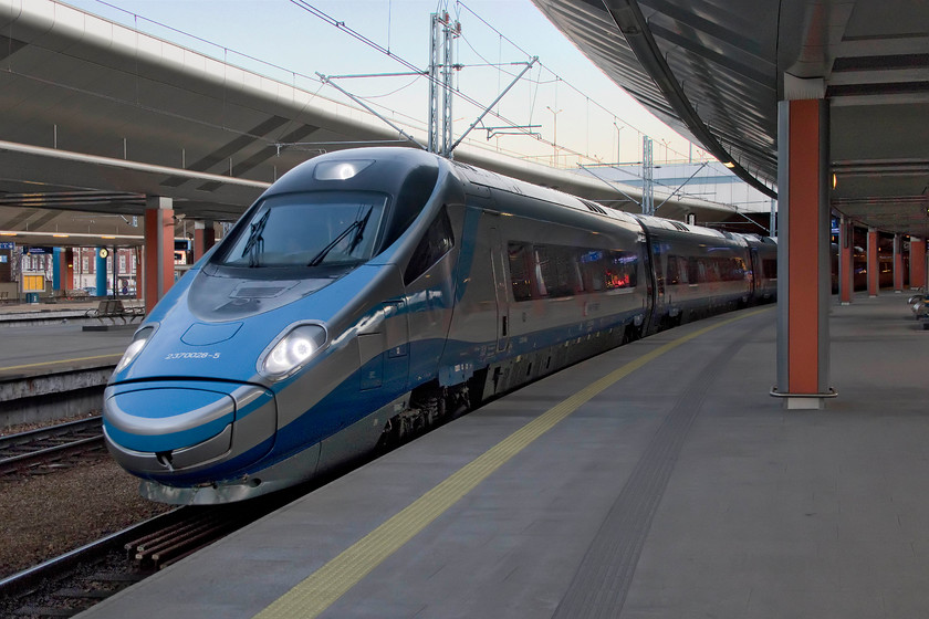 ED0250-004, 17.07-Krakw Glwny-Warszawa Wschodnia (EIP3102), Krakw Glwny station 
 A Polish Pendolino leaves Krakw Gleny station with the 17.07 high-speed service to Warszawa Wschodnia station. ED250-004 is one of twenty Pendolinos that operate on a number of Polish Railways' high-speed lines that are beginning to transform their network. Personally, I think that these ED250s look much smarter than our own Class 390s but they do represent the next evolutionary stage of this family of trains. 
 Keywords: ED250-004, 17.07-Krakw Glwny-Warszawa Wschodnia (EIP3102), Krakw Glwny station PKP Polish Pendolino