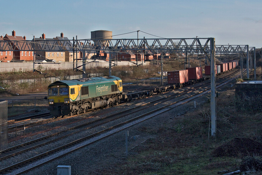 66504, 09.27 Southampton MCT-Garston (4M58, 35E), site of Roade station 
 In the lengthening winter afternoon sunshine 66504 leads the 4M58 09.27 Southampton MCT to Garston Freightliner through Roade. 66504 is a regular performer on this route and I have photographed it a number of times in my local area including at this spot back in the deep and dark days of the COVID-19 lockdown, see.... https://www.ontheupfast.com/p/21936chg/29181362604/x66504-12-57-london-gateway-garston 
 Keywords: 66504 09.27 Southampton MCT-Garston 4M58 site of Roade station Freightliner