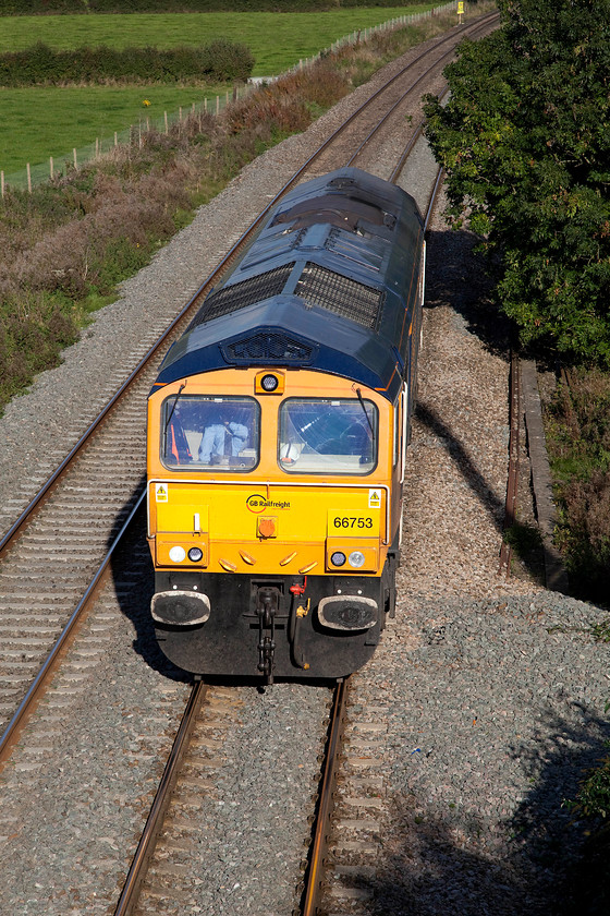 66753, 13.08 Whatley-Whatley LE (0Z42), Berkley ST802494 
 Having run up from Whatley quarry a little earlier, 66753 returns to it origin as the 0Z42 light engine move. Judging by the number of crew in the front and rear cabs it could well have been some sort of route familiarisation or training run? 
 Keywords: 66753 13.08 Whatley-Whatley 0Z42 Berkley ST802494