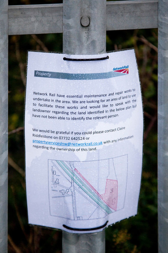 NR notice, Roade Hill 
 Crossing the Ashton Road bridge near to Roade I spotted this laminated notice recently placed on the palisade fencing. The plot of land that they are seeking to utilise is the old sewage treatment works, indeed the former brick aerator lagoons are still present in the undergrowth. Due to its previous use, presumably a municipal organisation, I am surprised that they have not been able to ascertain the current landowner. 
 Keywords: NR notice Roade Hill Network Rail