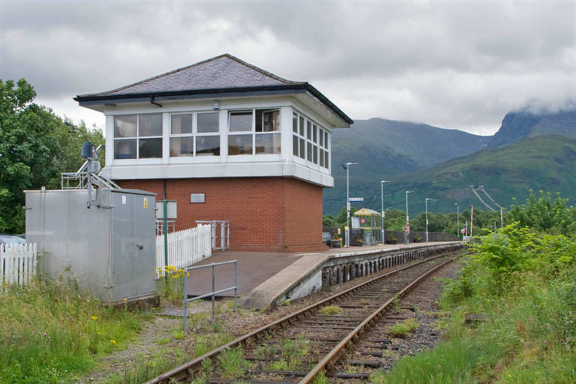 Banavie Signaling Centre signal box (BR, 1987) 
 I hesitate to call Banavie Signalling Centre a signal box but BR (Scottish Region) certainly made an effort to create a design that resembles one with its hipped slate roof and general design. At least it's not a portacabin unceremoniously dumped on the platform! This non-standard design was opened on 14.06.87 as a non-block post fitted with an individual function switch panel. In late 1987 it was upgraded to a block post controlling RETB all the way to Mallaig and the short distance to Fort William Junction. In the Spring of 1988, RETB control was extended to control the entire Oban line from Helensburgh and the Fort Willaim line via Tyndrum Upper. This final move precipitated the closure of all the mechanical signalling on the West Highland lines all except the strange anomaly of Mallaig Junction and, until 2011 Annat Junction, where the Corpach Scottish Pulp and Paper Mill had a crossing over the line at Lochaber. This crossing was converted to a CCTV remote crossing and led to the closure of a very unusual design of box. 
 Keywords: Banavie Signaling Centre signal box BR 1987