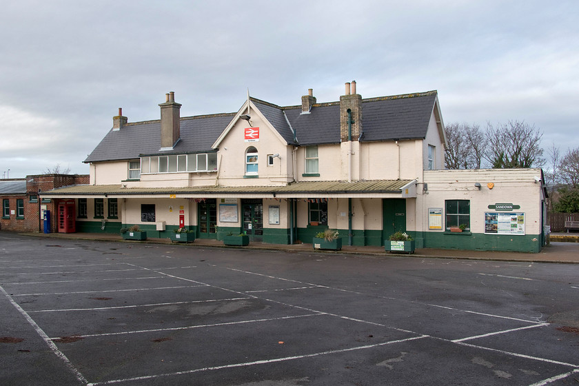 Frontage, Sandown station 
 The less than impressive frontage of Sandown station. Unlike its cousin a short distance away at Shanklin, this 1864 station is not so aesthetically appealing and is not listed. It had a nice looking caf occupying what would have been the old ticket hall and waiting room but, as it was only the third day of the new year, it was ferm! 
 Keywords: Frontage Sandown station