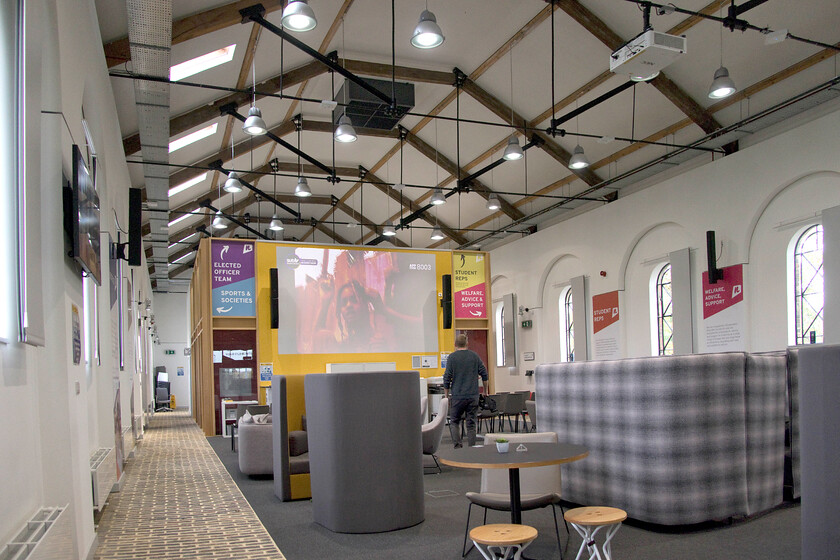 Interior of The Engine Shed, Students' Union building, UON Riverside campus 
 When I was a student back in the early 1980s our Student Union was little more than a Portakabin in the corner of a car park! Today this organisation is at the heart of student life with facilities to match as illustrated here at the University of Northampton. At UON's Riverside campus their activities are housed in the former Midland engine shed that was saved from almost certain decline and dereliction back in 2016. The superbly restored building is now a great resource for the students as well as for two much older railway enthusiasts who sat and enjoyed a relaxing coffee admiring the interior of the building! 
 Keywords: Interior of The Engine Shed Students' Union building UON Riverside campus