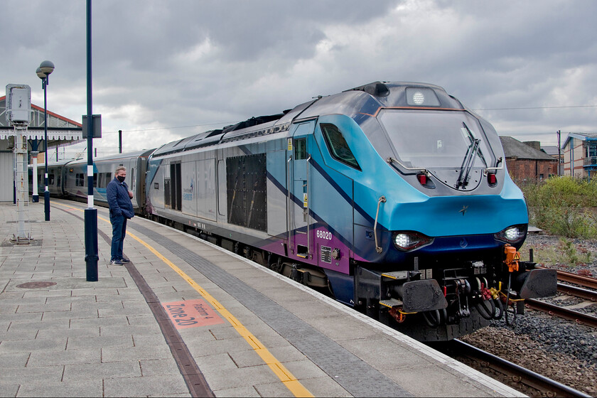 68020, TP 12.00 York-Scarborough (1T31, RT), York station 
 A month ago we took the same train, the 12.00 York to Scarborough as far as Malton, see..... https://www.ontheupfast.com/p/21936chg/30013497064/x68021-12-00-york-scarborough-1t31 However, this time, the locomotive is at the seaside end. 68020 'Reliance' leads the 1T31 service some fifteen minutes prior to its departure from a very chilly York station. 
 Keywords: 68020 12.00 York-Scarborough 1T31 York station TPE Trans Pennine Express Reliance