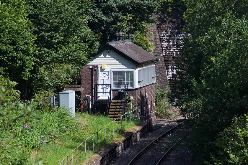 Neath & Brecon Junction signal box (GWR, 1892) SS749979 
 Neath and Brecon Junction signal box took a little finding and was extremely difficult to get a picture of. It now handles a handful of trains per week as virtually all of the coal traffic has dried up. All that remains is a class 66 trip up the valley to the Onllwyn washery plant and even this working is a little irregular. I suspect the end will come soon for this GW Type 5 box dating from 1892. Whilst the box is very reasonable condition, still having its finials on the gable ends, I am not sure about the authenticity of the front door that looks as though it was picked up from the local DIY store! 
 Keywords: Neath & Brecon Junction signal box SS749979