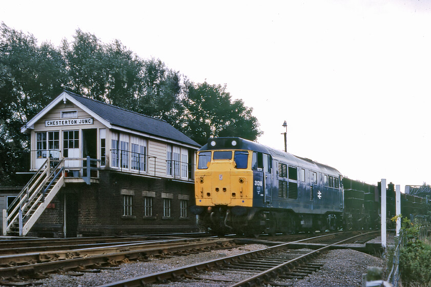 31218, down Presflo freight, Chesterton Junction 
 Technically not a very good quality photograph in tricky lighting sees 31218 passing Chesterton Junction just north of Cambridge. The Class 31 is leading a down train of Presflo wagons. I do not know where they may have been heading but there were flows of dried hydrate of alumina from Burtisland to Welwyn Garden City as well as sodium tripolyphosphate from Albright and Wilson at Corkickle to Procter & Gamble at West Thurrock both of which could well have passed this way, local advice appreciated! The train is passing the 1931 LNER box that was to close three years after this photograph was taken with the locomotive succumbing in 1988. 
 Keywords: 31218 down Presflo freight Chesterton Junction