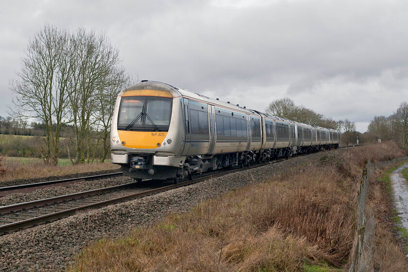 168325 & 168111, CH 11.37 Birmingham Moor Street-London Marylebone (1H29, RT), Clattercote SP455490 
 The 11.37 Birmingham Moor Street to London Marylebone Chiltern Railways service descends towards Banbury near the village of Claydon located in the very northerly extreme of Oxfordshire close to the Warwickshire and Northamptonshire county boundaries. The train is formed by two Turbo units in the form of 168325 and 168111. The photograph is taken from the security of a gated footpath flat crossing that it was noted was being monitored as two covert hidden cameras had been installed facing both directions across the line. Whilst sensible and measured security and safety on the railways is important this sort of thing goes too far in my opinion and I am pretty sure that a notice regarding the use of monitoring technology should be indicated to members of the public but no signage was present at this site. 
 Keywords: 168325 168111 11.37 Birmingham Moor Street-London Marylebone 1H29 Clattercote SP455490 Chiltern Railways Turbo