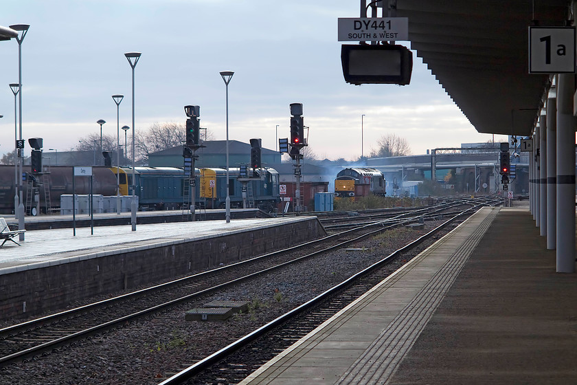 20096 & 20107, stabled 37800, 11.05 Derby Litchurch Lane-Leicester LE, Derby station 
 37800 lays a smoke screen over the southern end of Derby's station sidings as it positions itself to leave with the 11.05 light engine move to Leicester. In front, 20096 and 20107 are stabled. 
 Keywords: 20096 20107 stabled 37800 11.05 Derby Litchurch Lane-Leicester Derby station