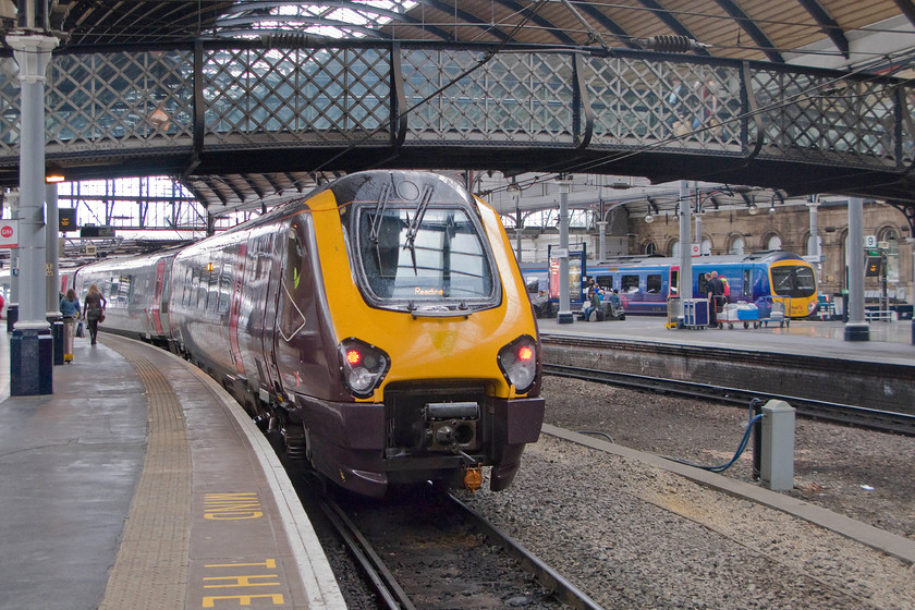 221138, XC 15.05 Newcastle-Reading (1V96) & 185147, TP 15.08 Newcastle-Liverpool Lime Street (1F71), Newcastle station 
 This view, inside Newcastle Central station, is very similar to York from the curvature of the track to the design of the latticed wrought iron footbridge. To the left 221138 waits to start its journey south as the 15.05 to Reading. In the bay platform to the right 185147 will leave a few minutes after the Voyager with the 15.08 to Liverpool Limes Street. 
 Keywords: 221138 15.05 Newcastle-Reading 1V96 185147 15.08 Newcastle-Liverpool Lime Street 1F71 Newcastle station Voyager Desiro Cross Country Trans Pennine Express