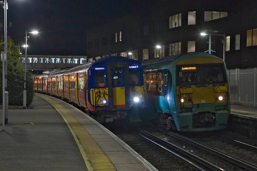 455742, SW 20.35 Dorking-London Waterloo & 456022, SN 20.06 Horsham-London Victoria, Dorking station 
 A pair of EMUs stand at Horsham station in the dark of an April evening. Both the Class 455 to the left and the 456 to the right must rank as the ugliest design of train frontages out there! Both are built around a BR Mk. III coach they are cluttered and rather utilitarian with the 455 having the addition of a connecting door. 455742 will work the 20.35 South West Trains service to Waterloo whilst 456022 is about to leave working the Southern 20.06 to Victoria. 
 Keywords: 455742 20.35 Dorking-London Waterloo 456022 20.06 Horsham-London Victoria Dorking station Southern