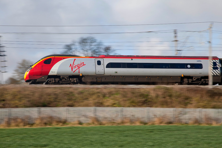 390127, VT 07.25 Wolverhampton-London Euston (1B06), Milton Crossing 
 A Pendolino in full flight! 390127 'Virgin Buccaneer' passes Milton Crossing just north of Roade Cutting with the 1B06 07.25 Wolverhampton to London Euston. 
 Keywords: 390127 07.25 Wolverhampton-London Euston 1B06 Milton Crossing