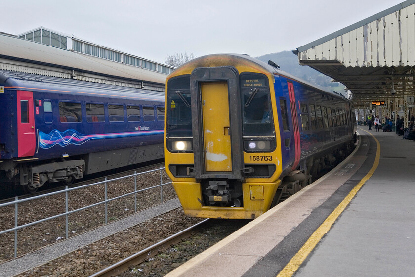 158763, GW 11.10 Weymouth-Bristol Temple Meads & GW 13.30 Bristol Temple Meads-London Paddington, Bath Spa station 
 As the 13.30 Bristol to Paddington HST service waits at Bath Spa's platform two 158763 gets away from the station working the 11.10 Weymouth to Bristol train. 
 Keywords: 158763 11.10 Weymouth-Bristol Temple Meads 13.30 Bristol Temple Meads-London Paddington Bath Spa station FGW HST First Great Western