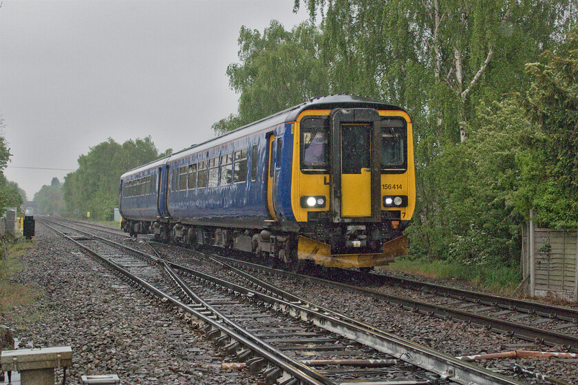 156414, EM 10.28 Peterborough-Doncaster (2K10, RT), Bessacarr Junction 
 In appalling weather 156414 works the 10.28 Peterborough to Doncaster service on the approach to its destination at Bessacarr Junction. Notice that the unit is completely devoid of any branding. I am not sure as to why this is as it has been an EMR/EMT unit for many years? 
 Keywords: 156414 10.28 Peterborough-Doncaster (2K10, RT), Bessacarr Junction