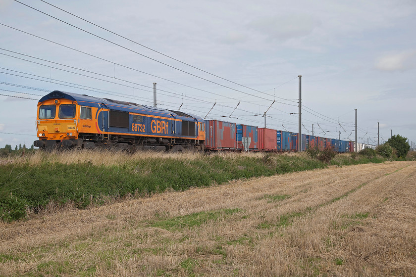 66732 & 700132, 03.14 Dollands Moor-Hornsey EMUD (Via Peterborough) (6X71), Holme Green TL192420 
 66732 'GBRf The First Decade 1999-2009 John Smith MD' leads a number of former Freightliner boxes and flats acting as barrier vehicles and then , just in view, one of the new class 700 EMUs on a gauging run. The unit is 700132 that is being towed as the 08.14 Dollands Moor to Hornesy EMUD via Peterborough. The train is seen heading south at Holmes Green near to Biggleswade. 
 Keywords: 66732 700132 03.14 Dollands Moor-Hornsey EMUD 6X71 Holme Green TL192420