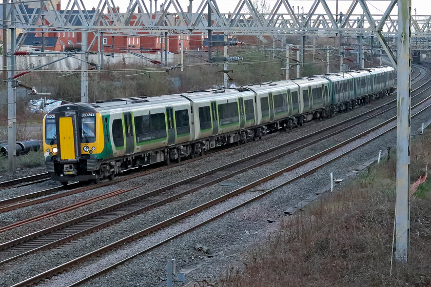 350243, LN 13.56 London Euston-Birmingham New Street (1Y29, 2L), site of Roade station 
 350243 leads a stablemate past the site of Roade's former station working the 13.56 Euston to Birmingham train. A quick computer check reveals that I have surprisingly few images of this particular unit. 
 Keywords: 350243 13.56 London Euston-Birmingham New Street 1Y29 site of Roade station London Northwestern Desiro