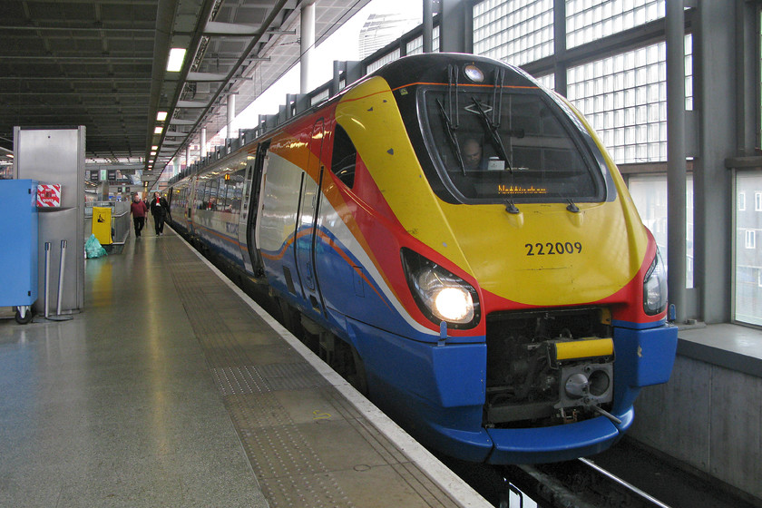 222009, EM 15.29 London St. Pancras-Nottingham (1D49), London St 
 Whilst the Barlow trainshed at St. Pancras is a superb structure that is a place to visit in its own right even if you are not actually taking a train, the Midland line station is not so impressive, it's just too 'slabby' and clinical, and that if you can actually get on it! The gateline is too small, as is the actual station, with staff herding passengers like animals into roped off channels that I find extremely irritating. Anyway, gripes aside, 222009 waits at the station to leave with the 15.29 to Nottingham. We took this 1D49 service to Wellingborough. 
 Keywords: 222009 15.29 London St. Pancras-Nottingham 1D49 London St. Pancras station Meridian East Midlands Trains