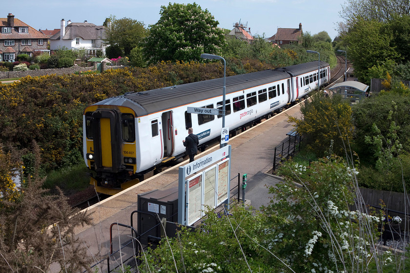 156407, LE 10.45 Norwich-Sheringham (2S14, RT), West Runton station 
 Almost the greenery at the tiny station of West Runton 156407 pauses with the 10.45 Norwich to Sheringham working. Opened in 1887, West Runton is just one of the two original Midland and Great Northern Joint Railway stations still open, the other being Cromer. 
 Keywords: 156407 2S14 West Runton station