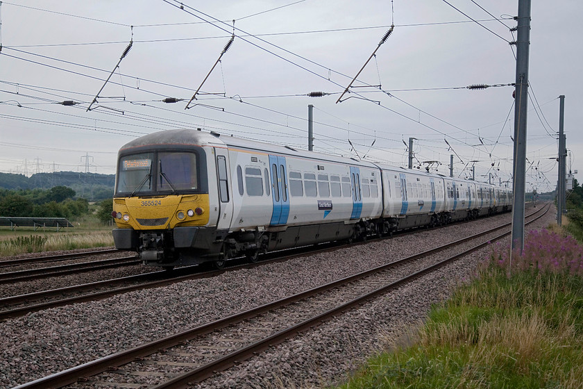 365524 & 365541, GN 08.09 London Kings Cross-Peterborough (1P00, 1E), Sandy TL175510 
 Networkers 365524 and 365541 have just left Sandy station working the 08.09 King's Cross to Peterborough. These units have done excellent work on the GN lines but their time is coming to and end. By the start of 2018 it is likely that some will go off lease as new class 700s are introduced. 
 Keywords: 365524 365541 1P00 Sandy TL175510