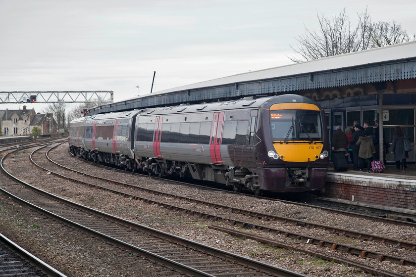 170107, XC 11.45 Cardiff-Nottingham (1M64, 1L), Gloucester station 
 Cross Country 170107 arrives into Gloucester station forming the 11.45 Cardiff Central to Nottingham. In the halcyon days of British Rail, this working would have been handled by a rake of 6 or so coaches, perhaps Mk.1s, and a hefty locomotive up front. Class 45 'Peaks' were synonymous with this route for some years, how things have changed, for the better, I'll let you decide? 
 Keywords: 170107 1M64 Gloucester station