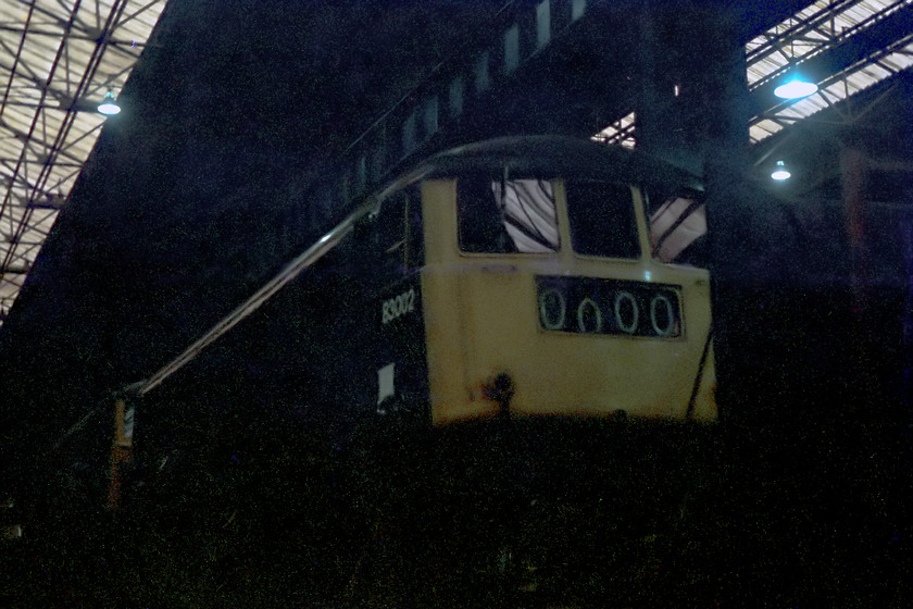 83002, undergoing overhaul, Crewe Works 
 83002 receives attention at Crewe Works. A bit of dark and 'atmospheric' shot but one of very few I have class 83s. This engine was new in 1960, and withdrawn in 1983. It was cut up at Vic Berry's in Leicester.