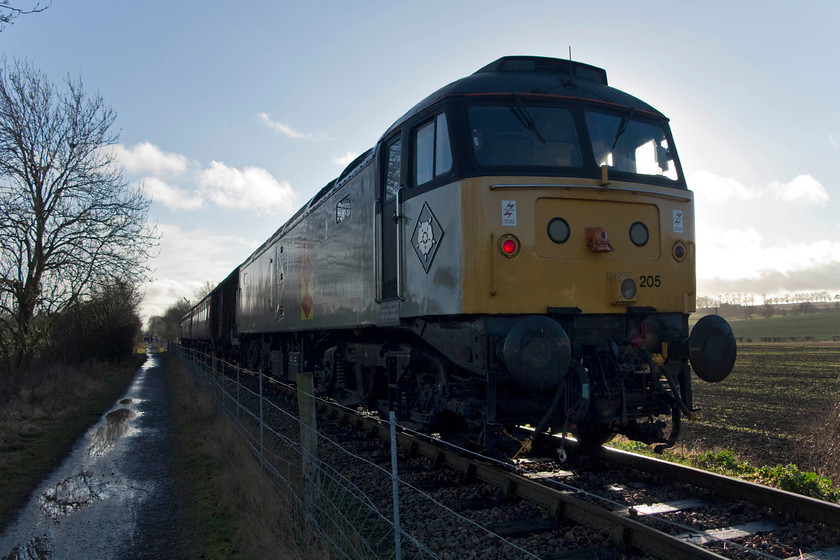 47205, 14.00 Pitsford & Brampton return, Merry Tom Lane 
 Taken into the afternoon sunshine on New Year's day 47205 is seen in charge of the 14.00 out and back working on the PItsford and Lamport railway. 47205 is kept very smart at the NLR , and at the the time of writing, is their prime mover! The train is seen as it waits to return to Lamport close to Merry Tom Lane where had parked our car. 
 Keywords: 47205 Northampton and Lamppost railway NLR Merry Tom Lane