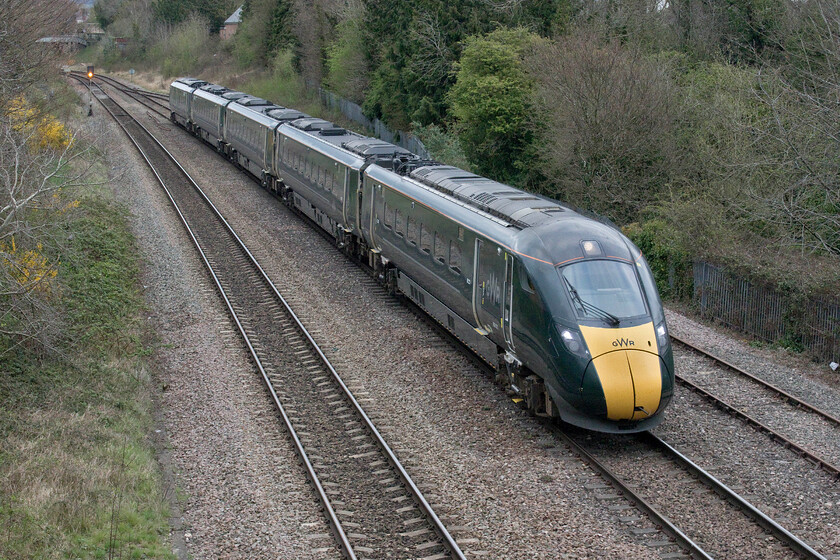 800021, GW 16.59 Cheltenham-London Paddington (1L84, 1L), Cloddy bridge 
 After a short layover in Alstone sidings just north of Cheltenham station IET 800021 passes Cloddy bridge heading back to London working the 16.59 Cheltenham to Paddington 1L84 service. Back in the 1980s, I stood on this bridge photographing the very same services but then they had a Class 50 or a 47 hauling a set of air conditioned Mk. II stock; how things have changed! 
 Keywords: 800021 16.59 Cheltenham-London Paddington 1L84 Cloddy bridge Great Western Railway IET