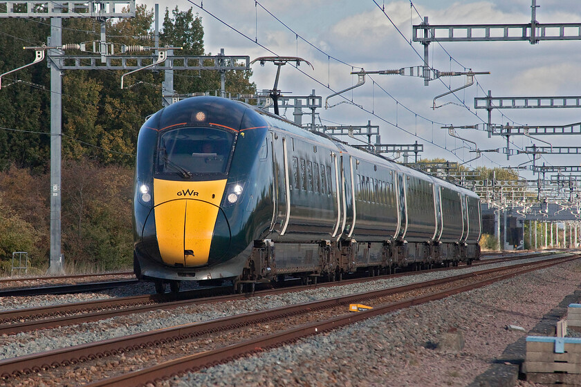 800028, 14.28 London Paddington-Cheltenham Spa (1G19, 2L), Grove foot crossing SU393911 
 Knowing that Andy and I were going to visit one of the last few remaining open flat crossings on the GWML I packed my trusty but tragically underused 80-200 zoom lens attached to my Canon full-frame camera. Utilising its capabilities at Grove on the Challow loops 800028 is seen at line speed (125 miles per hour) working the 1G19 14.28 Paddington to Cheltenham Spa service. 
 Keywords: 800028 14.28 London Paddington-Cheltenham Spa 1G19 Grove foot crossing SU393911 GWR IET