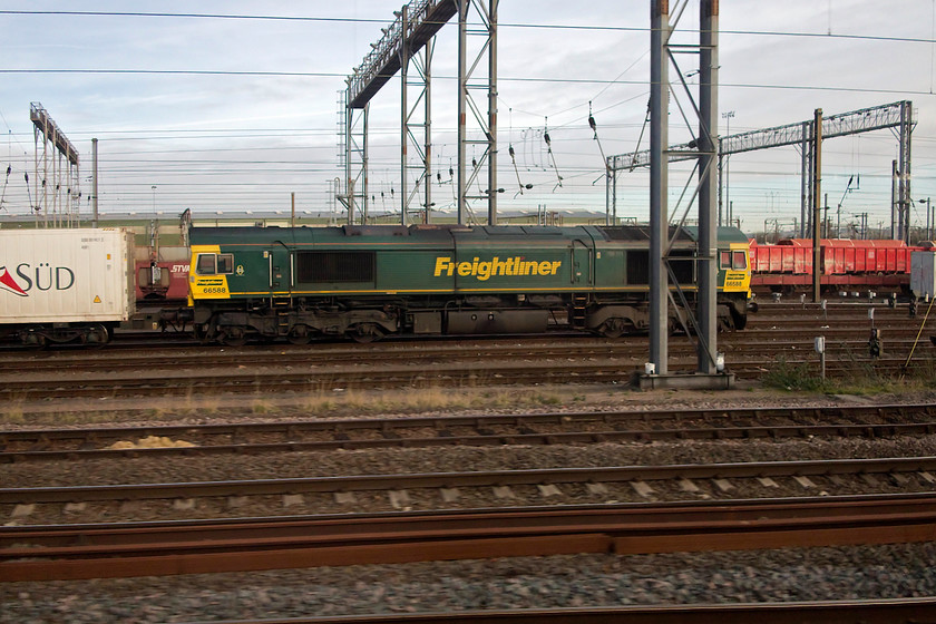 66588, up Freightliner, Wembley Yard 
 Whilst passing Wembley Yard 66588 was seen at the head of an unidentified up Freightliner working. 
 Keywords: 66588 Freightliner Wembley Yard