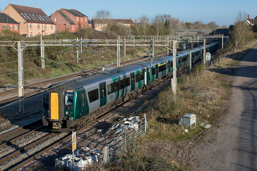 350103 & 350404, LN 07.37 Northampton-London Euston (1N82, 1L), site of Roade station 
 At any normal time, this 07.37 Northampton to Euston 1N82 service would be packed to the gunwales with commuters heading south. However, COVID has other ideas and now the train, being worked by 350103 and 350404 (a former TPE set), is virtually empty judging by the number of people I observed sitting socially distanced through the train windows as it passed. One wonders if things will ever revert to type with packed commuter trains taking tens of thousands of workers to their office jobs in London? 
 Keywords: 350103 350404 07.37 Northampton-London Euston 1N82 site of Roade station London Northwestern desiro