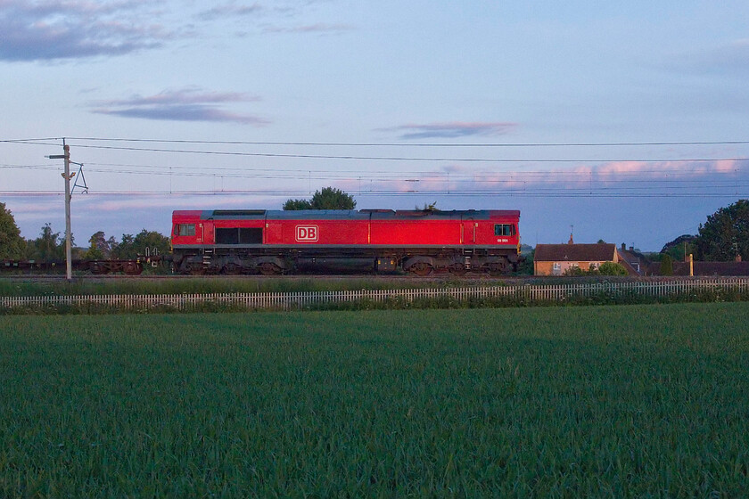 66084, 01.22 Dollands Moor-Ditton Foundry (6M13, 3E), Milton Malsor SP740557 
 With the early morning sun just illuminating the flanks of 66084 it is seen passing Milton Malsor a short distance south of Northampton. The Class 66 is leading the 6M13 01.22 Dollands Moor to Ditton freight which is not one that I have many photographs of due to its anti-social timings through Northamptonshire! 
 Keywords: 66084 01.22 Dollands Moor-Ditton Foundry 6M13 Milton Malsor SP740557