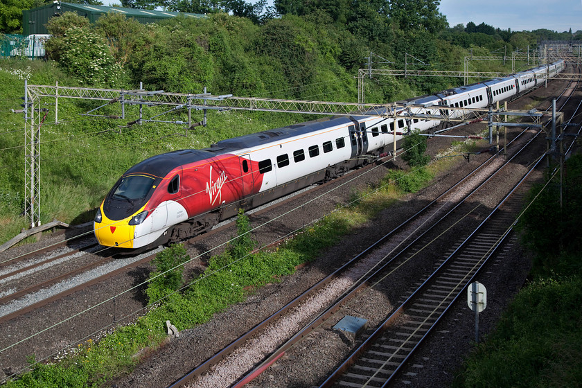 390011, VT 06.45 Wolverhampton-Lodon Euston (1B04, 10L), Victoria Bridge 
 In its new 'flying silk' livery, 390011 'City of Lichfield' heads past Victoria Bridge between Northampton and Milton Keynes working the 06.45 Wolverhampton to London Euston. This arrived 10 minutes late at its destination, a delay that was much less than many on this morning due to the closure of the Northampton line. 
 Keywords: 390011 1B04 Victoria Bridge