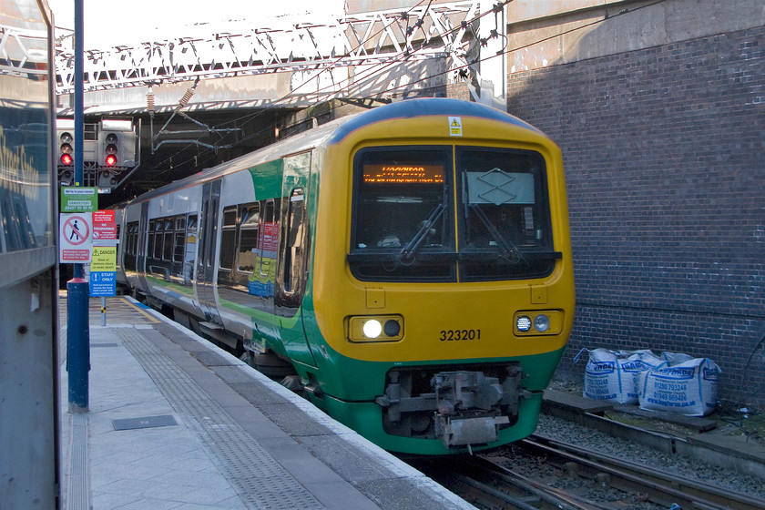 323201, LM 15.45 Lichfield-Redditch (2R63), Birmingham New Street station 
 323201 arrives at New Street station forming the 15.45 Litchfield to Redditch service. These units were the last to be introduced by the pre-privatised BR in 1992. As well as operating in the West Midlands, as seen here, they have also seen use in the north-west. 
 Keywords: 323201 15.45 Lichfield-Redditch 2R63 Birmingham New Street station