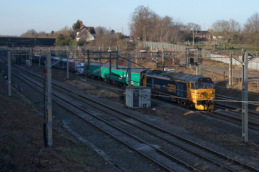 50049 & 458505, 11.22 Clapham Yard-Widnes Transport Tech (5Q26, 5E), site of Roade station 
 50049 'Defiance' brings up the rear of the 11.22 Clapham Yard to Widnes Tech 5Q26 move as it passes the site of Roade station. The move was to get South Western Railway's 458505 unit to the Alstom Merseyside facility for its overhaul and refit. Leading the train at the front, now out of site, is 50007 'Hercules'. Who would ever have thought that forty-four years ago that I would be photographing the same locomotive still earning its keep if looking a little different and in an alternative location, see https://www.ontheupfast.com/p/21936chg/25468143404/x50049-12-30-london-paddington-paignton 
 Keywords: 50049 458505 11.22 Clapham Yard-Widness Transport Tech 5Q26 site of Roade station Defiance South West Railway GBRf