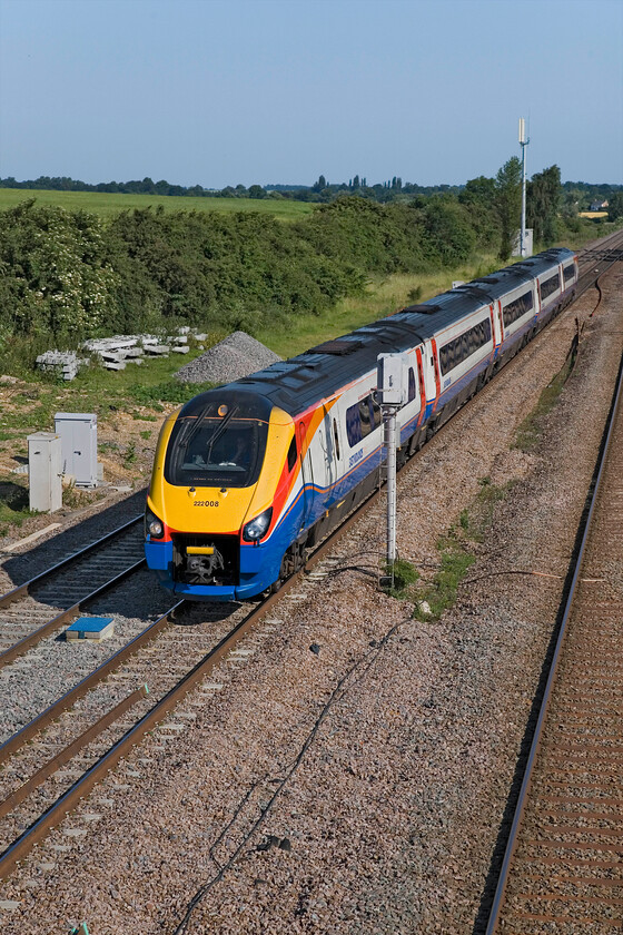 222008, EM 08.15 Corby-London St. Pancras (1P19), Lower Farm Road, Bromham TL028518 
 In glorious summer sunshine, 222008 passes Bromham at line speed working the 08.15 Corby to St. Pancras service. Despite being designated a Class 1 express service it seems a little incongruous that Class 222 Meridans operate what are, essentially, local stopper services. I suspect that the lack of appropriate stock drives this and begs the question as to what stock will be used when (if ever!) the electrification is completed. 
 Keywords: 222008 08.15 Corby-London St. Pancras 1P19 Lower Farm Road Bromham TL028518 EMT Meridian