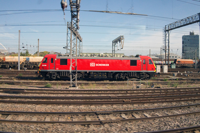 90040, stabled, Willesden yard 
 Looking smart in the early autumn sunshine in Wembley yard, 90040 is seen stabled between duties. I like the symmetry created by the barrel distortion of the lens at its widest 15.1mm in this picture. So, I deliberately have not used Photoshop's transform functions to straighten things up as I would normally do. 
 Keywords: 90040 Willesden yard