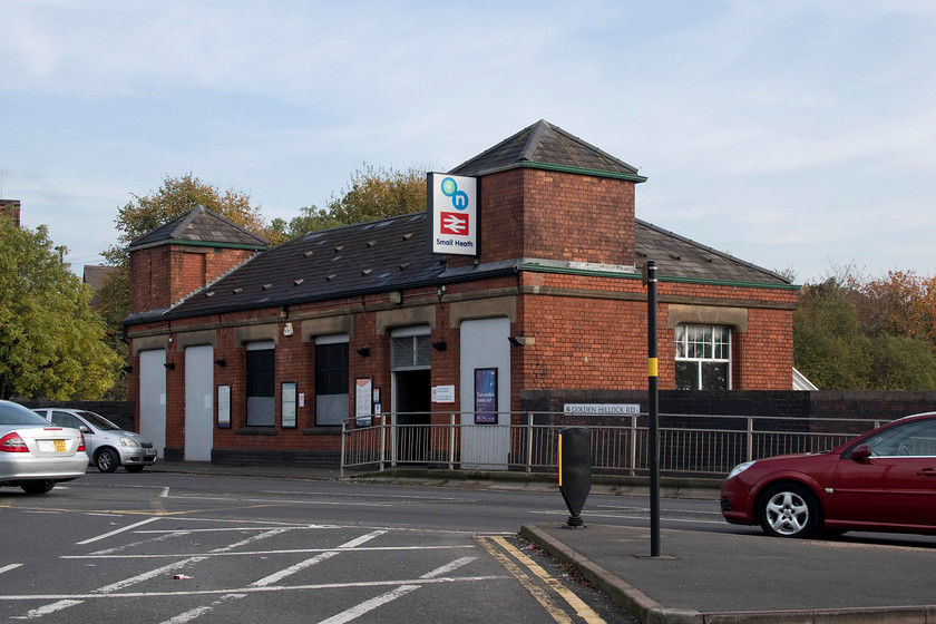 Frontage, Small Heath station 
 The Small Heath station building is seen looking a little down on its luck on Golden Hillock Road. The station was opened in 1863 by the Great Western Railway with the station expanded in 1906 when the Birkenhead to Paddington route was quadrupled south of Birmingham. The only access to the station is via the entrance to the left of this view with one island platform still in use. The other entrance is boarded up and the platform out of use. However, the station has seen a steady rise in patronage over recent years so is there a possibilty that the closed pltaform will reopen in the future I wonder? 
 Keywords: Frontage Small Heath station