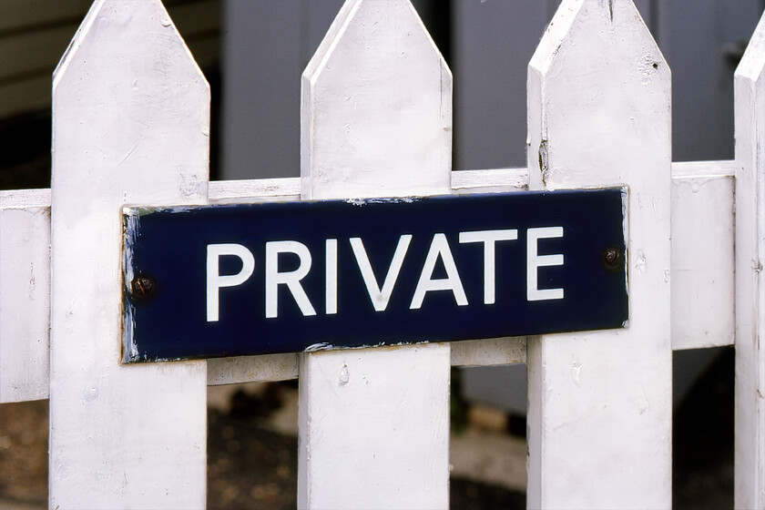 Enamel, Magdelen station 
 In my contemporary notebook from 1981, I wrote that at Magdalen there was an 'LNER blue enamel on the entrance gate to the signal box.' Looking at the sign now it appears to be of BR (Eastern) heritage rather than LNER but its existence is still of interest. Notice that when the gate was painted the sign was not removed with rather crude over painting around the edges; perhaps the flat head screws were too rusted up or was it just laziness on behalf of the operative? 
 Keywords: Enamel Magdelen station