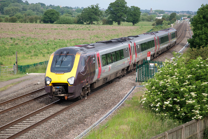 Class 220, XC 05.45 Sheffield-Reading (1V81), Warkworth SP476394 
 A class 220 four-car set heads south near the village of Warkworth forming the 1V81 05.45 Sheffield to Reading. The Voyager was forced to a walking pace at this location as it was only four minutes behind the class 50 hauled Purbeck and Bomo railtour that itself was caught behind a Chiltern stopper. Once the Marylebone service had cleared Aynho Junction the two faster services would be able to get a move on and catch up any missed time. 
 Keywords: Class 220 05.45 Sheffield-Reading 1V81 Warkworth SP476394